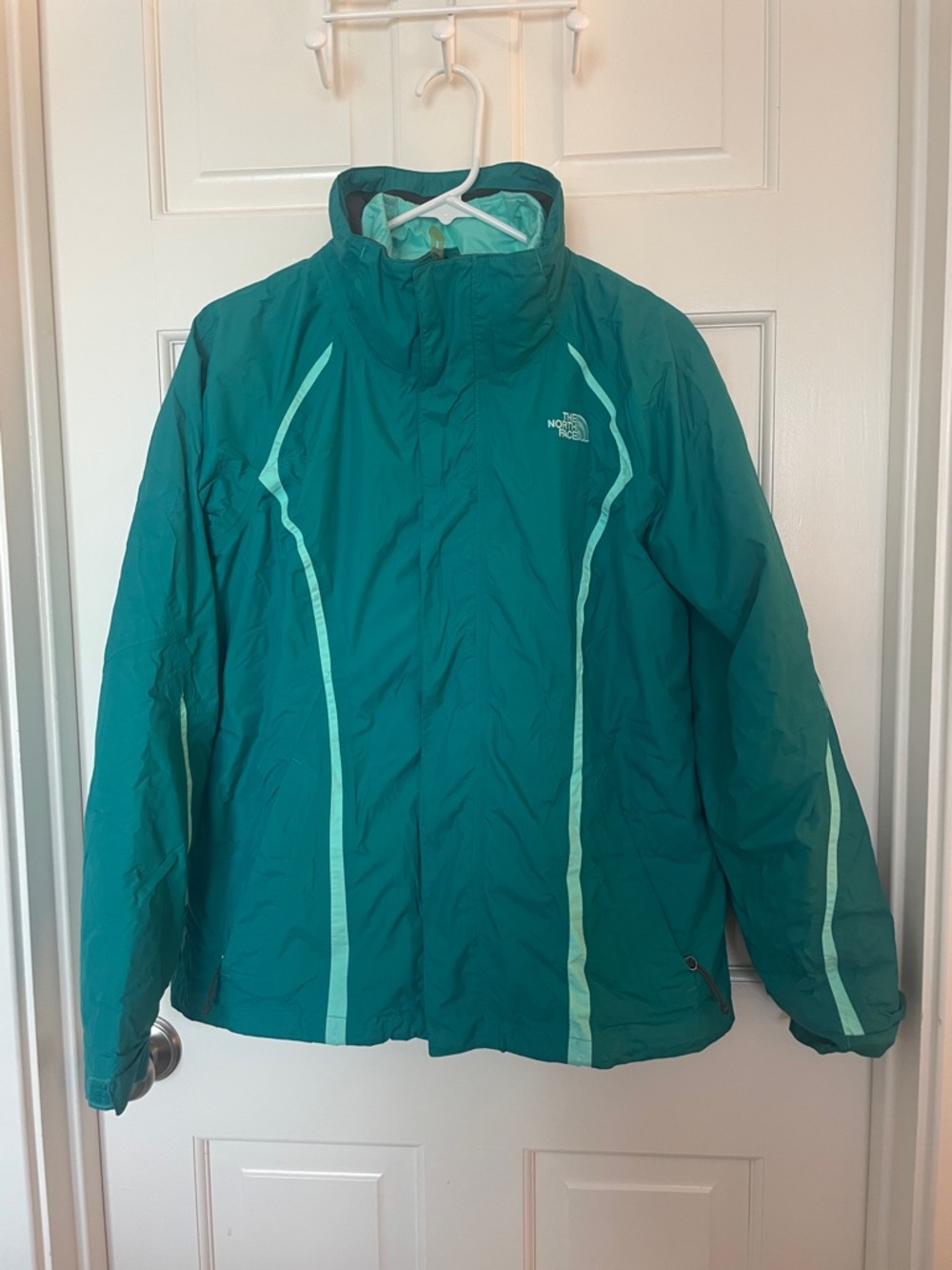 The North Face teal jacket with mint contrast piping